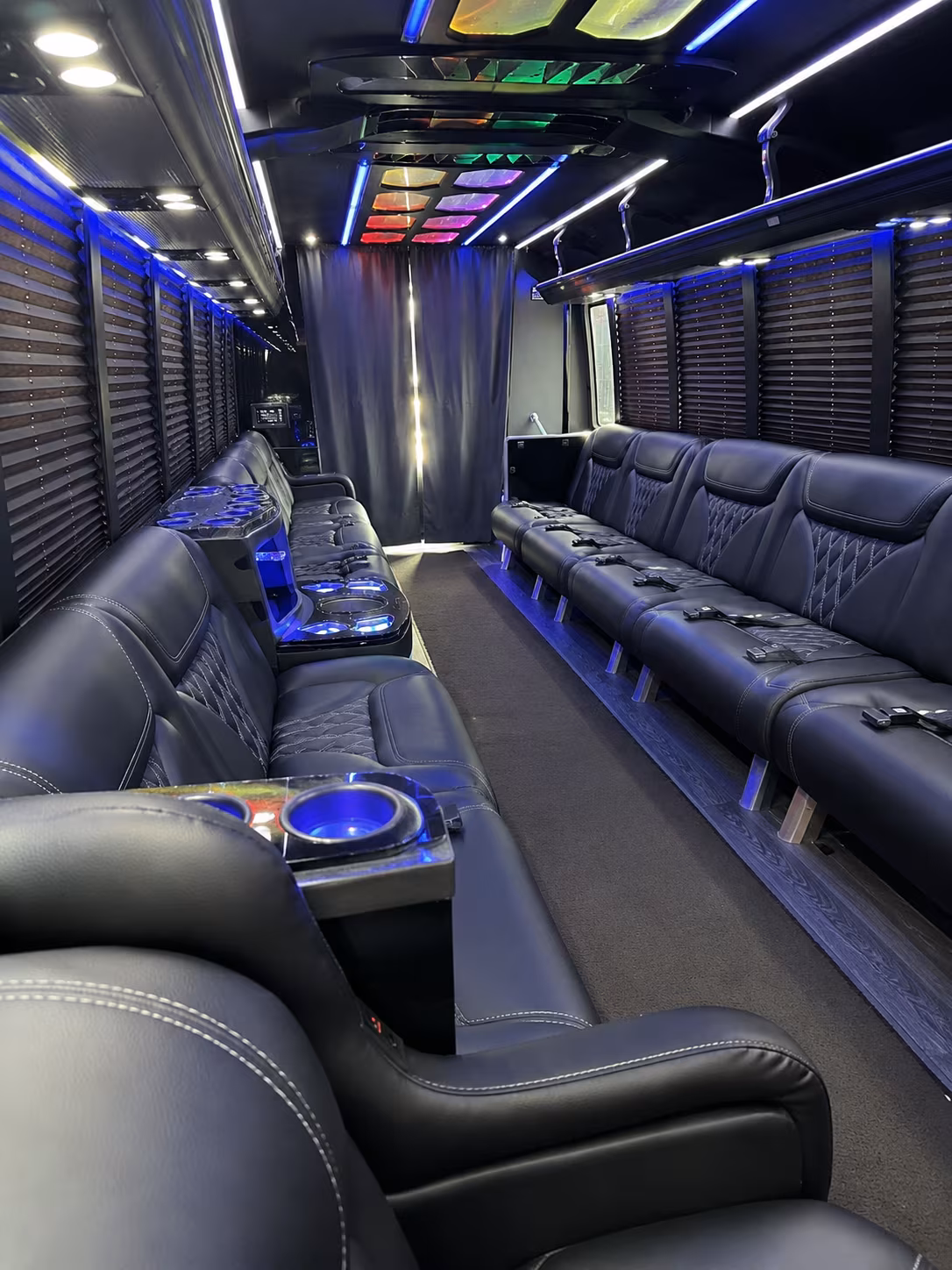 Friends laughing during a party bus celebration in Fort Worth